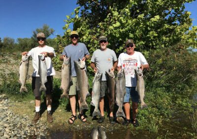 Men holding King Salmon catch
